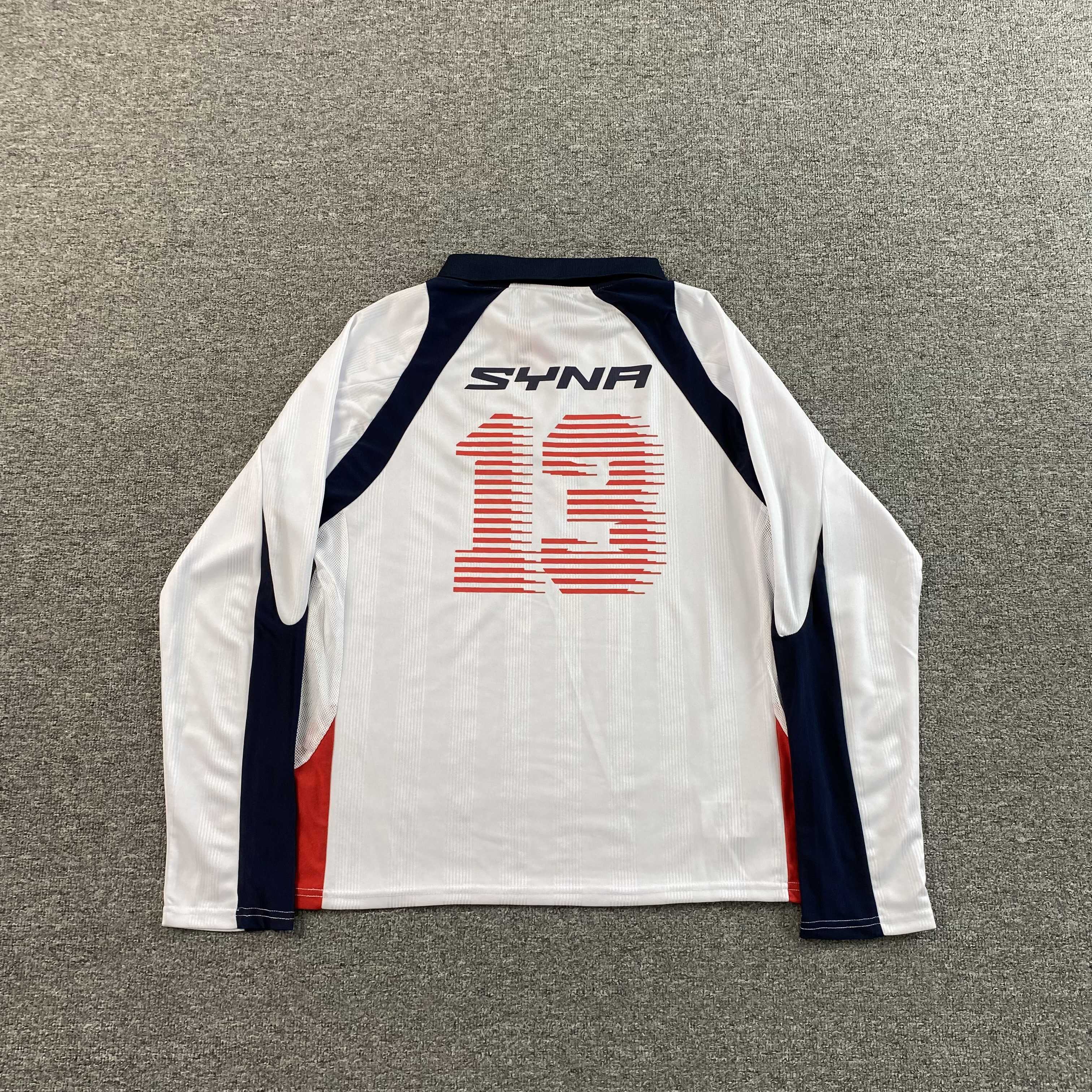 SYNA WORLD DVL FOOTY V2 T SHIRT